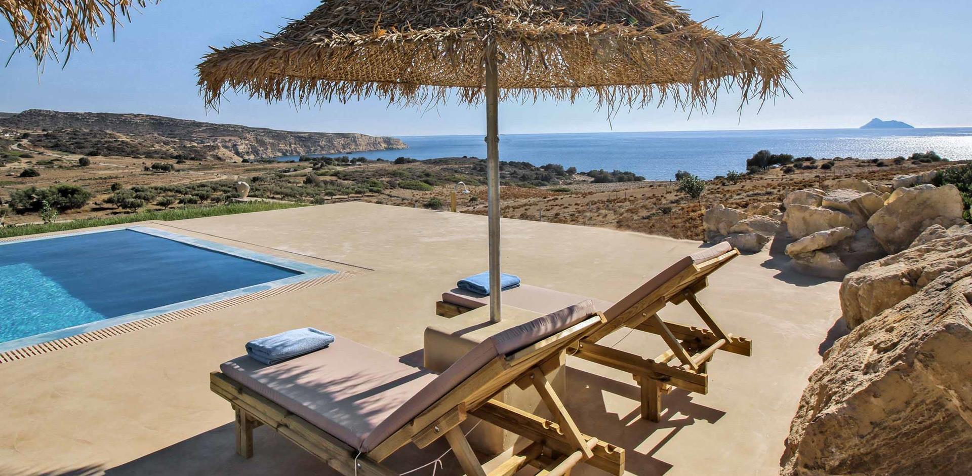 Sun loungers and parasol next to pool, Villa Orcadia, Crete, Greece, Europe